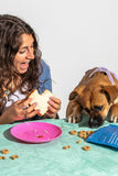 Dog Eating Wild One Organic PB and J Biscuits